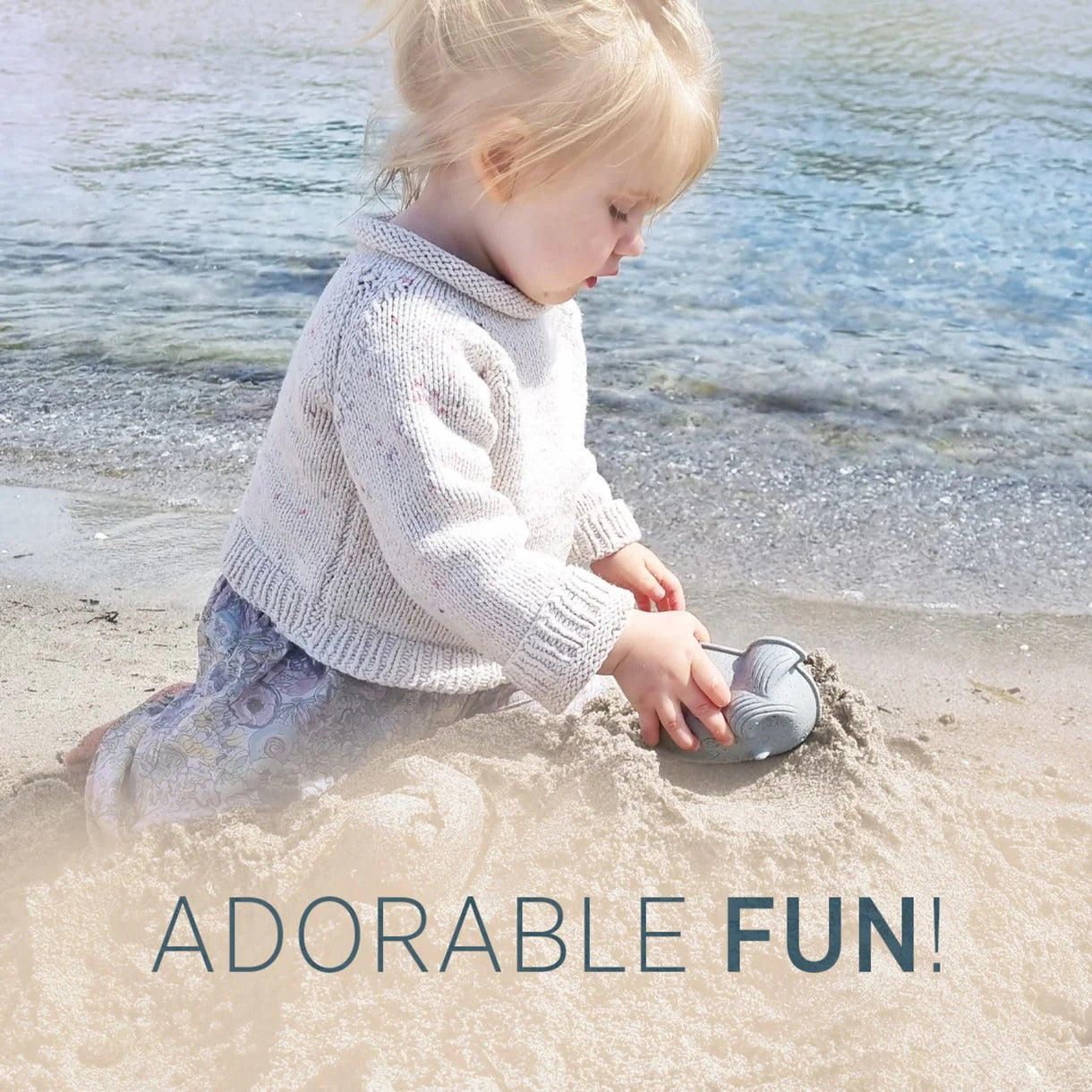 Child playing in the sand with text 'ADORABLE FUN!' at the beach